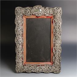 Edwardian silver mounted photograph frame, of rectangular form embossed with scrolling flo...