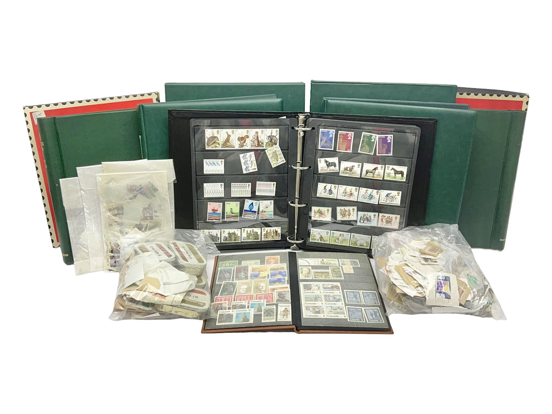 Mostly Queen Elizabeth II Great Britain and Isle of Man stamps including mint examples, housed in various albums, stockbooks and loose, in one box