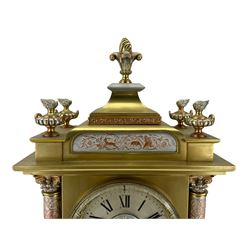 French - late 19th century 8-day patinated and silvered brass cased mantle clock, with a tiered pediment surmounted by a central finial with mounted flambé finials to the corners, silvered two-part dial with Roman numerals, steel hands and a cast bezel flanked by two circular columns with Corinthian capitals, with contrasting applied filigree decoration to the pediment, pillars and front of the case, rectangular stepped plinth with a decorative base on block feet, Japy Freres twin train Parisian movement with square movement plates and rack striking, sounding the hours and half-hours on a coiled gong. With pendulum.