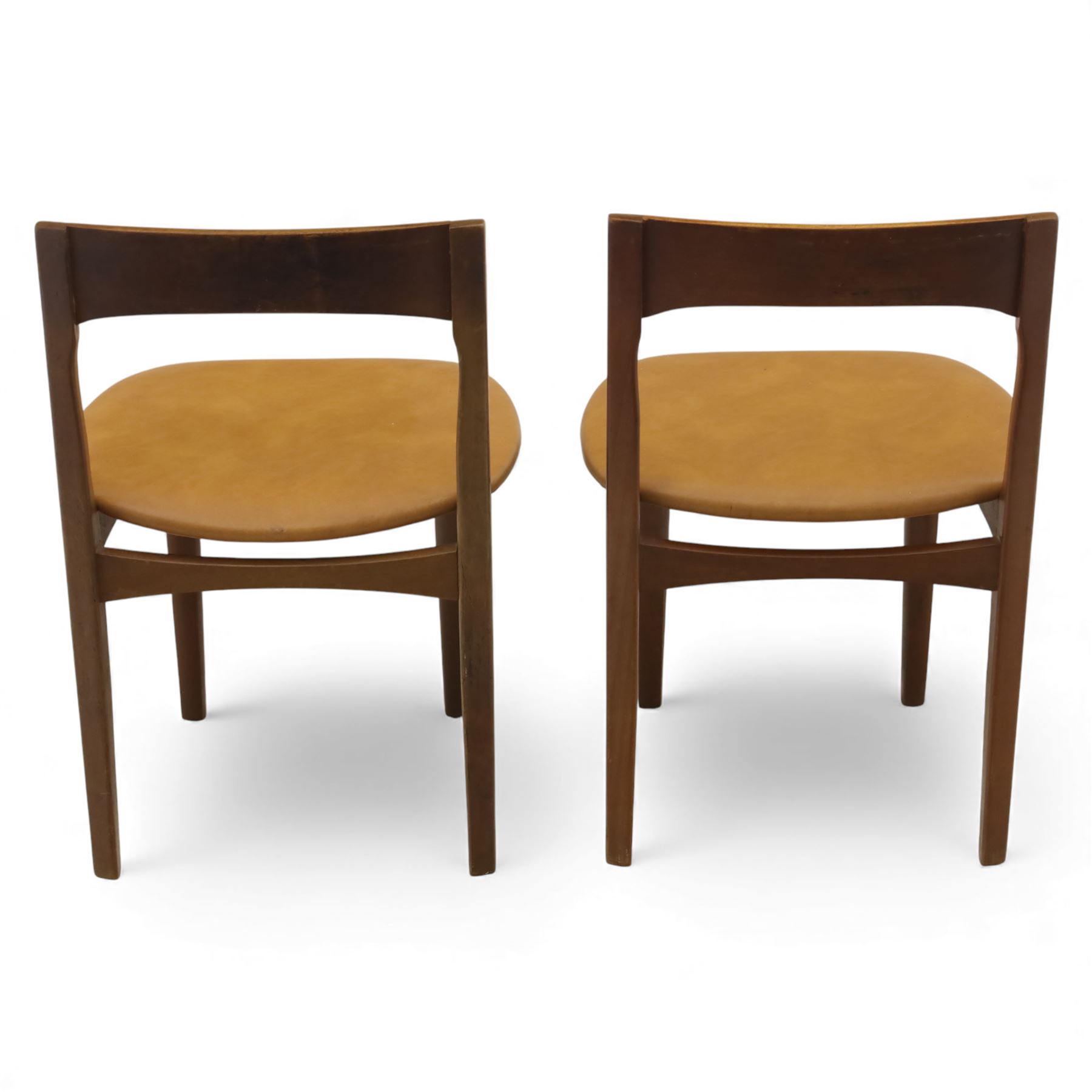 Mid 20th century living room furniture, comprising of a pair of Nathan teak dining chairs, each with curved open backrests and shaped seats, together with a Danish teak coffee table, rectangular top inset with decorative ceramic tiles, on square tapered supports
Chairs (H 73cm, W 48cm)
Table (H 41cm, W 81cm, D 47cm)