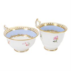 Minton trio, coffee cup, teacup and saucer, circa 1824, moulded ribbed detail, distinctive 'N' handle, painted in pattern no 139, with floral sprays and lilac blue band, coffee cup including handle H8cm, saucer D14cm, together with a Spode trio, coffee cup, teacup and saucer, circa 1830, decorated in the 3886 pattern, painted with pink cabbage roses and heightened with gilt, coffee cup including handle H8cm, saucer D15cm