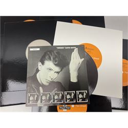 Fifteen Royal Mail David Bowie Fan Sheet presentation sets, housed in presentation wallets in the form of vinyl records, together with two Royal Mail limited edition David Bowie stamp art souvenir folders, sealed, and three David Bowie: The Berlin Years limited edition souvenir covers