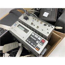 Cased Sony 'Trinicon' HVC-200P video camera, Sony Betamax portable video cassette recorder, cased Sony Video 8 CCD-V100E video camera, Sony SL-F1UB portable video cassette recorder, two Sony AC power adaptors etc