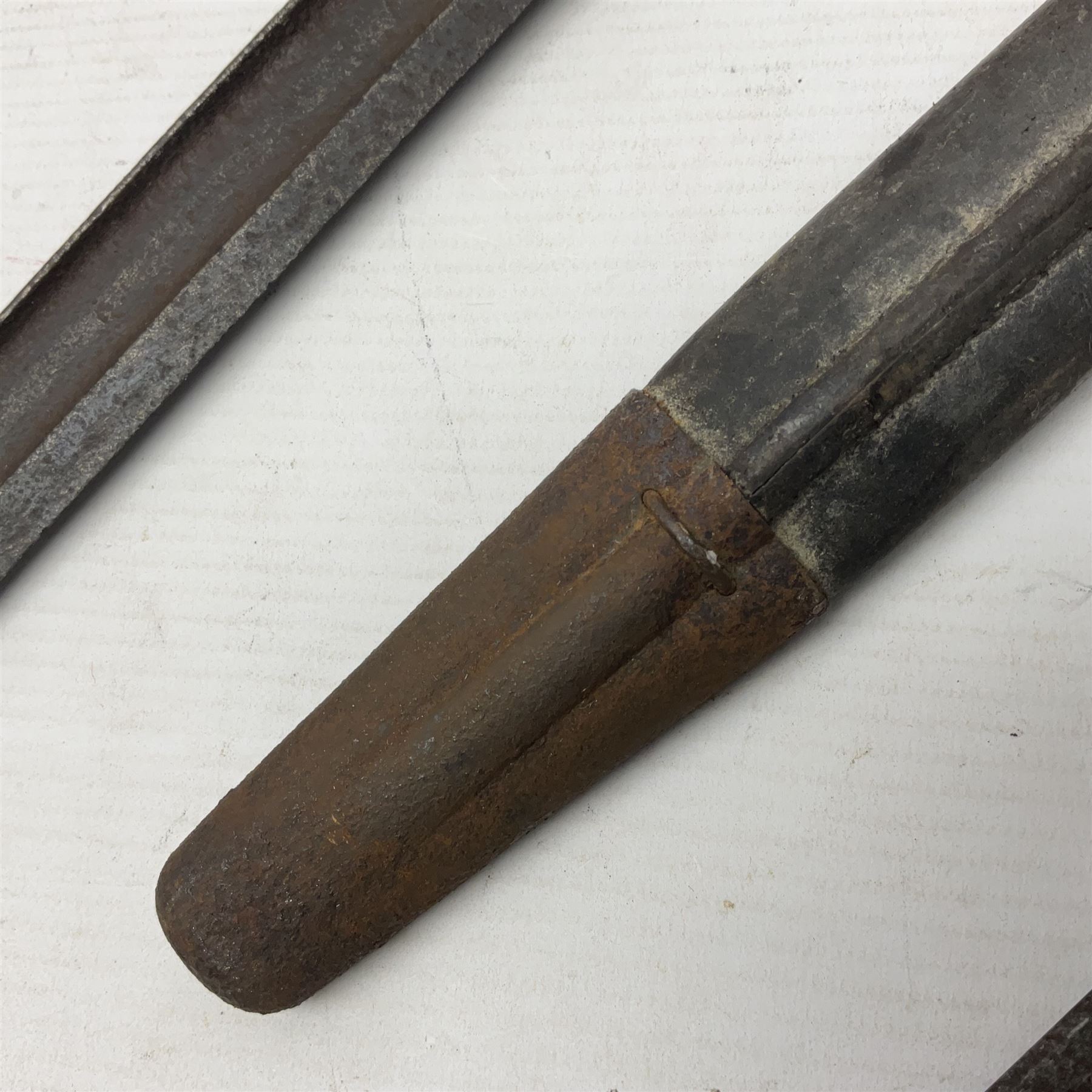 WWI Remington Pattern 1913 bayonet, the 43cm fullered blade with various marks to the ricasso including date code 11 16; in leather covered scabbard with various stamps including JWB 17 L58cm overall; and a French Model 1866 sabre bayonet (no scabbard)