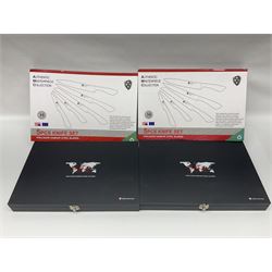 Two cased Swiss knife sets