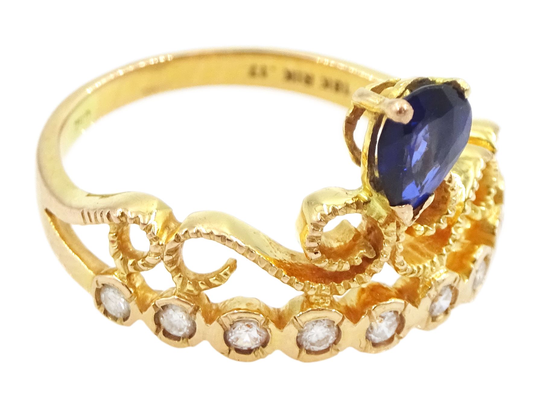 18ct gold pear cut sapphire and nine stone round brilliant cut diamond openwork ring, stamped 750