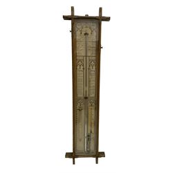 Admiral Fitzroy - Early 20th century Fitzroy barometer in a glazed gothic influenced oak case with chamfered uprights and top and base panels, full length paper scales with Fitzroy's observations and predictions, mercury bulb cistern, storm glass, spirit thermometer and brass sliding vernier pointers. Retailed by Inglis & Son, Coney Street, York.