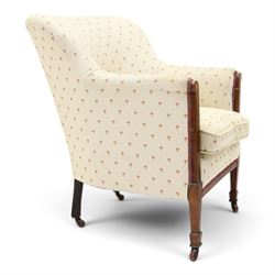 Edwardian inlaid mahogany armchair of modest proportions, spoonback and loose seat cushion on sprung seat upholstered in ivory ground floral fabric, on square tapering supports with ceramic castors