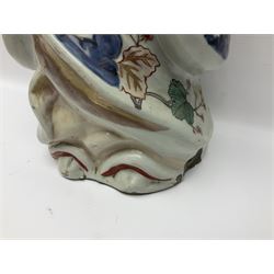 Large Japanese Imari porcelain figure, modelled as a Bijin, wearing a long kimono decorated with apple blossom and leafy branches on a white ground, with gilt detailing, possibly Edo period, H63cm