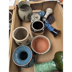 Collection of studio pottery, including bowls, vases, goblets and bottles, in four boxes 