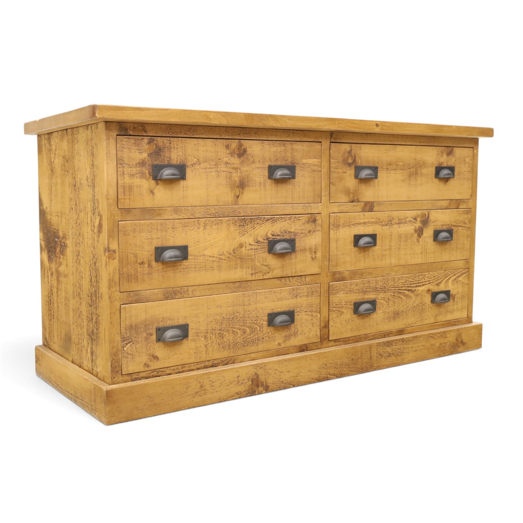 Indigo Furniture - large rustic oak chest, rectangular top fitted with six drawers with metal pull handles, on skirted base