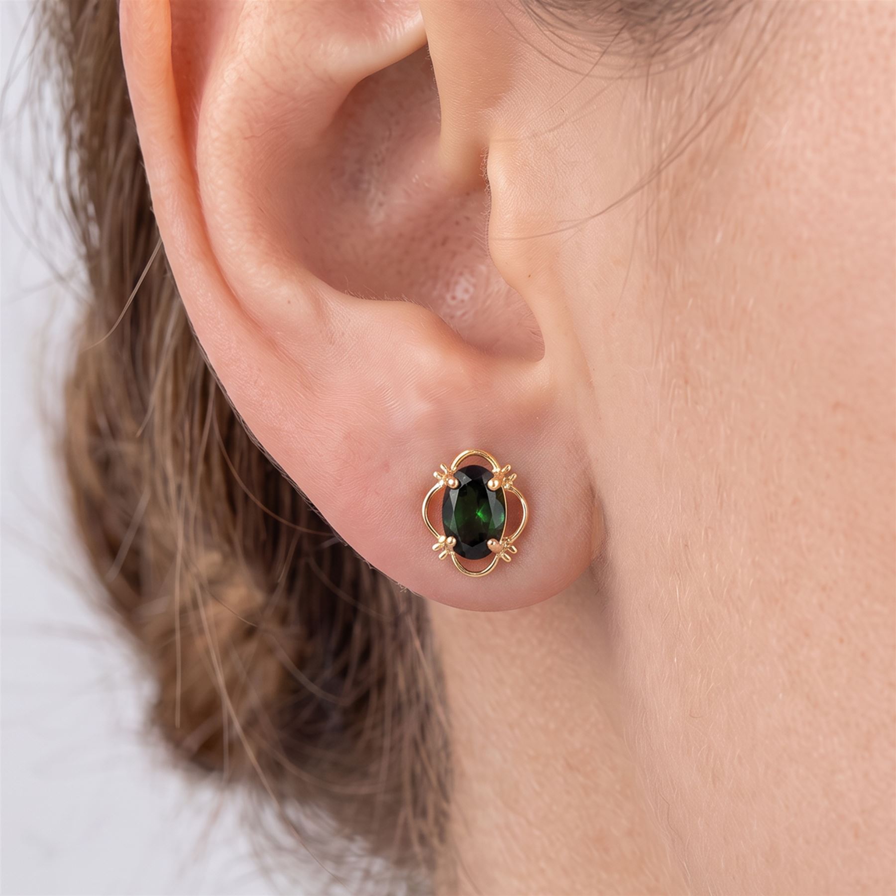 Pair of 9ct gold green tourmaline stud earrings, stamped 