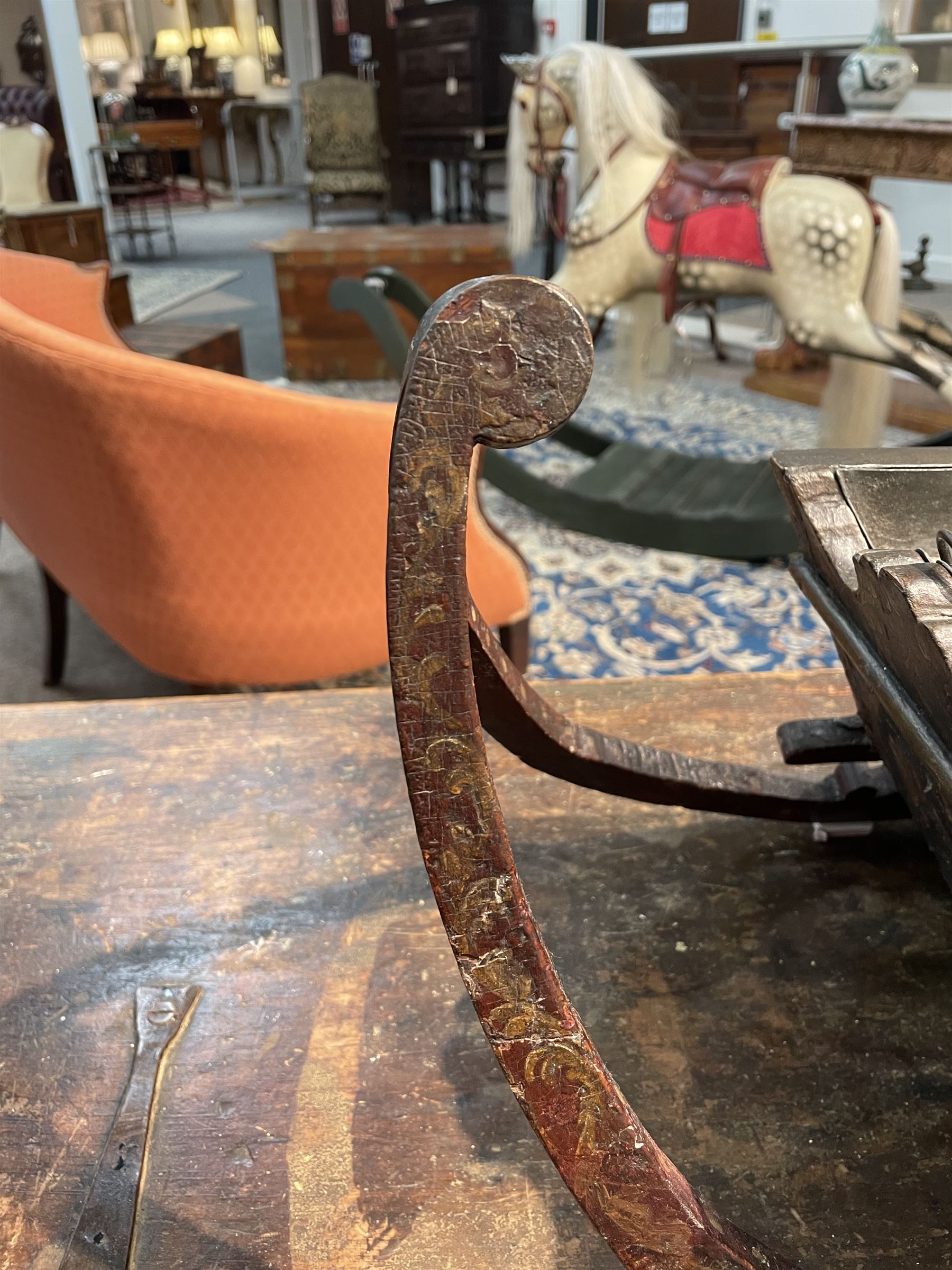 Unusual 18th century small Northern European wooden sled, with curved scroll back, the sides painted with coastal shipping scenes, the interior with removable zinc liner, upon curved irons painted with flower heads, H36cm W56cm D29cm