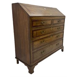 Early 19th century oak and mahogany banded converted bureau chest, the sloped top lifts from the bottom to reveal fitted compartment, over two short false drawers and three long drawers, on bracket feet