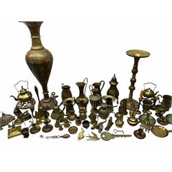 Large brass vase with tulip neck and frilled rim, H78cm, large candlestick with domed base and knopped baluster stem H51cm, along with a collection of other brassware. 