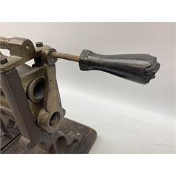 Victorian cuff and collar tabletop mangle, the ribbed brass rollers in a cast iron frame mounted on a wooden base