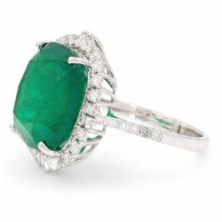 18ct white gold emerald and diamond cluster ring, single cushion cut emerald of approx 13.20 carat, surrounded by round brilliant and baguette cut diamonds and diamond set shoulders, stamped 18K, total diamond weight approx 1.00 carat