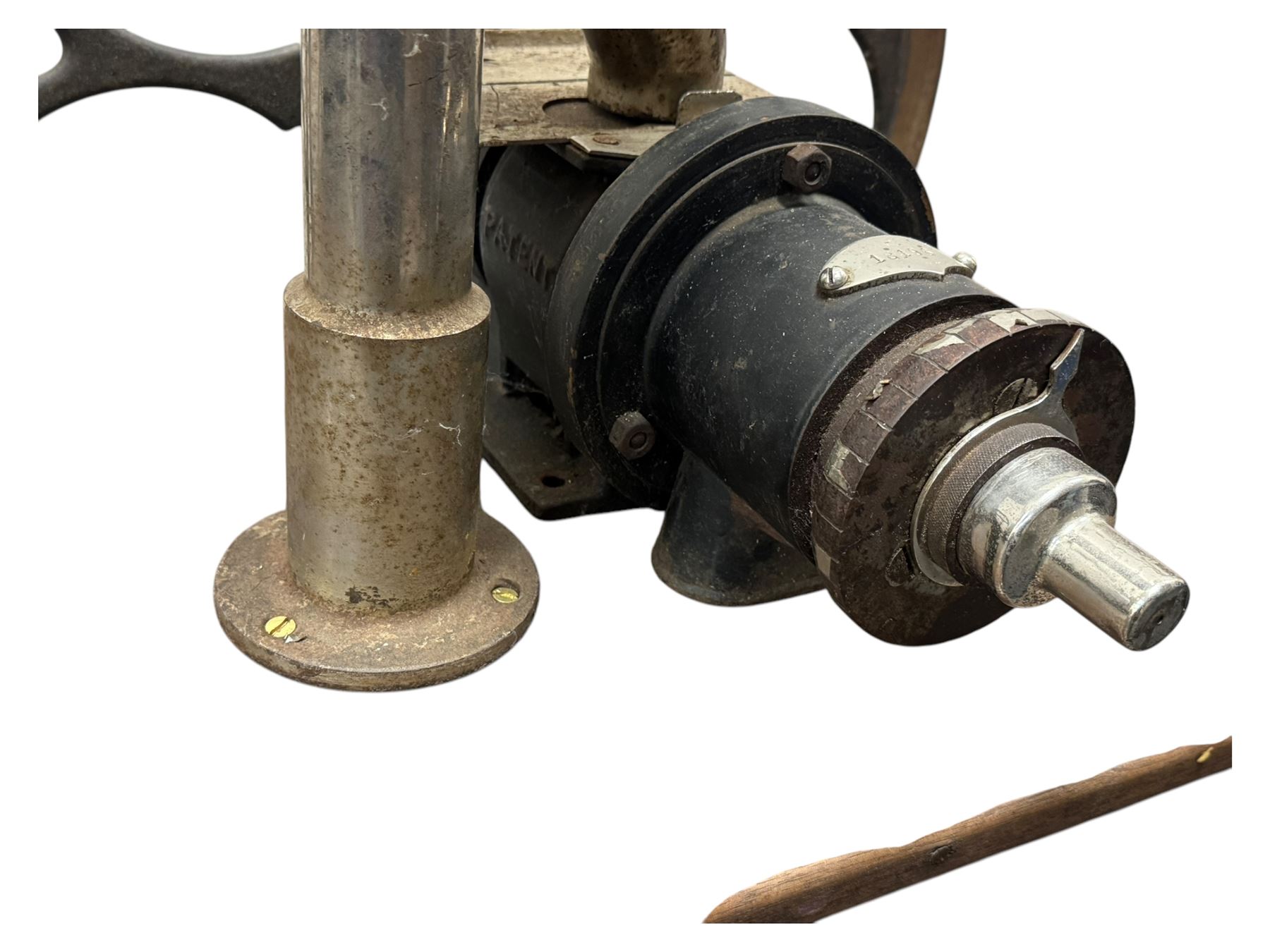 Cabinet with multiple drawers and cupboards mounted with two industrial coffee grinders with large flywheels and brass coffee reservoirs, early 20th century 