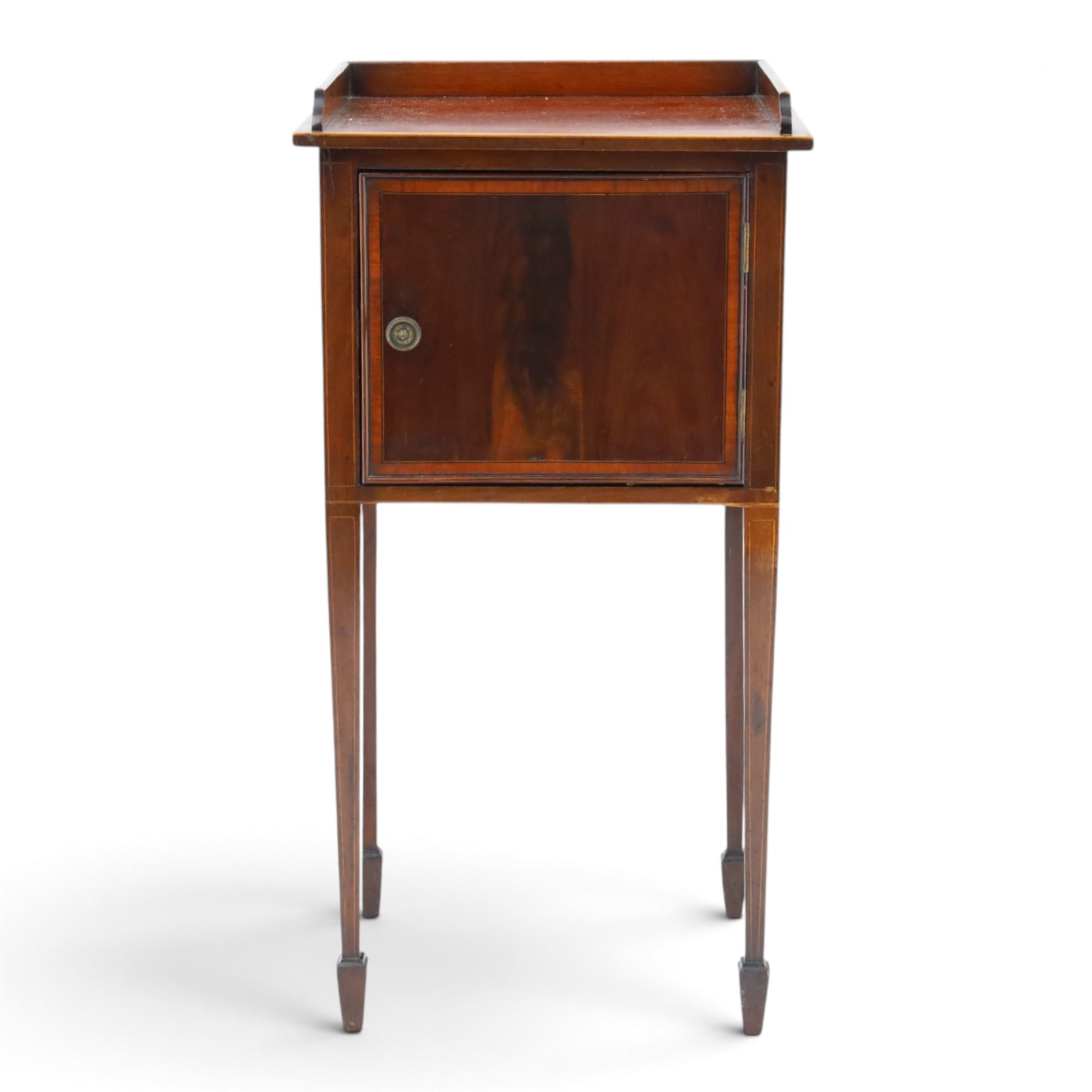 Edwardian mahogany pot cupboard, with three quarter galleried top, single cupboard door, raised on square tapering supports terminating in spade feet
