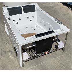Two person fibreglass jacuzzi bath with cushions and built in TV and CD player. - THIS LOT IS TO BE COLLECTED BY APPOINTMENT FROM DUGGLEBY STORAGE, GREAT HILL, EASTFIELD, SCARBOROUGH, YO11 3TX