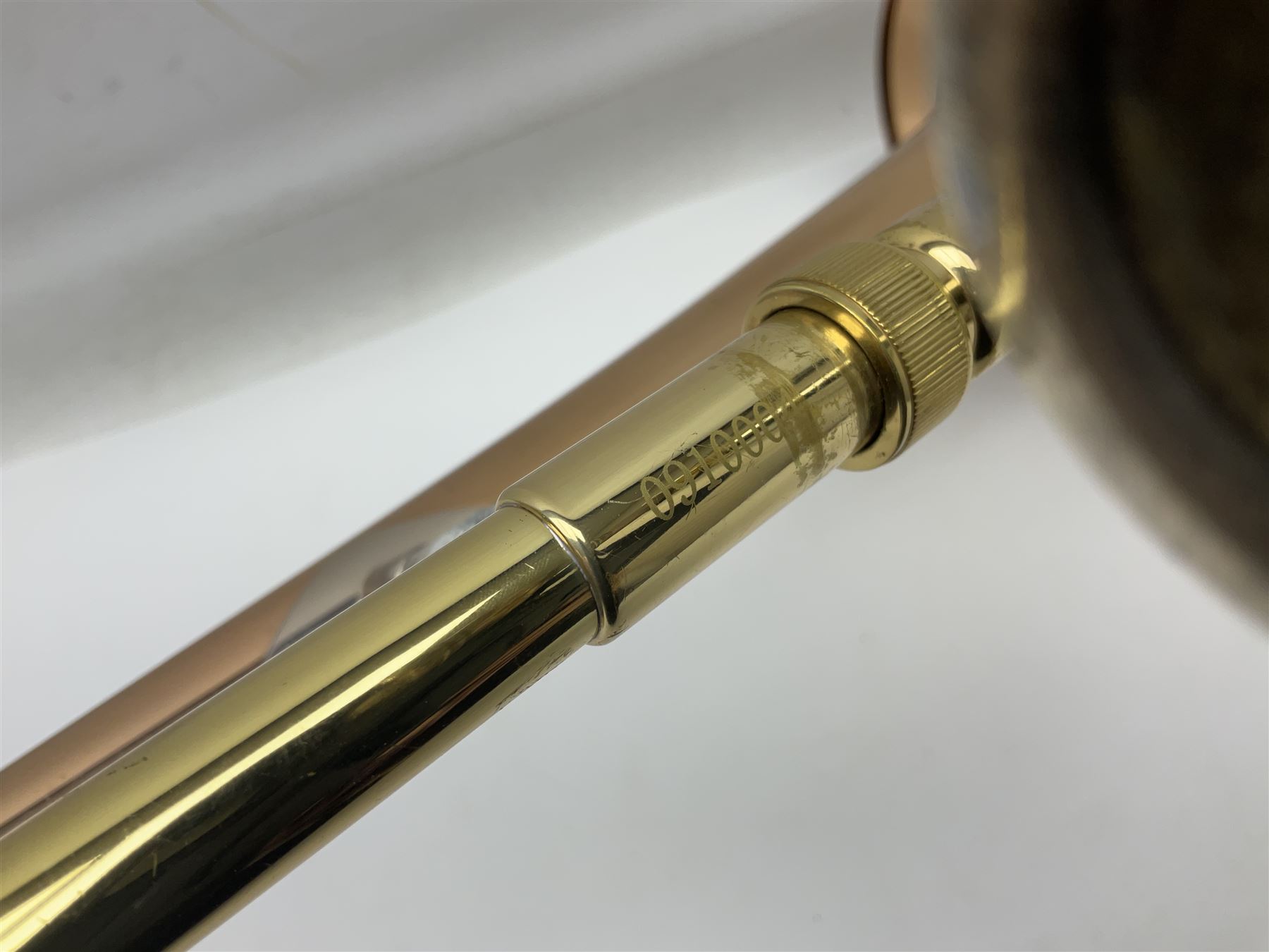 Sebastian Bucklet Aquae Sulis copper and brass trombone No.0910004; in lightweight carrying case; and Kinsman folding tubular chrome music stand in case (2)