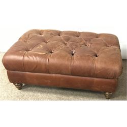 Large rectangular footstool upholstered in a deep buttoned fabric, turned supports