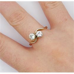 18ct gold two stone round brilliant cut diamond crossover ring, stamped, total diamond weight approx 0.75 carat