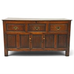 18th century oak dresser base, rectangular top over three drawers, fitted with twin panell...