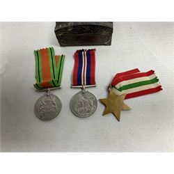 WWII service medal trio comprising Defence Medal, 1939-1945 medal and 1939-1945 Star, with various ribbons and box