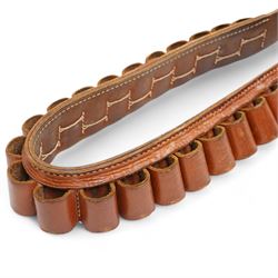 Churchill canvas shot gun case with leather corners and baize lined interior with trade label 'E J Churchill (Gunmakers ) Ltd ' with cleaning rods  and a leather 12 gauge cartridge belt