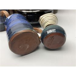 Wold studio pottery tankards, in various colours and relief decoration together with other studio items including vases, jugs and pots 