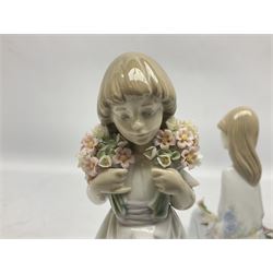 Three Lladro figures, comprising Flower Song no 7607, Spring Bouquets no 7603 and School Days no 7604, with original boxes, largest example H22cm 