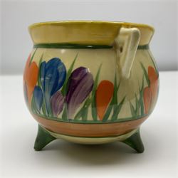 Clarice Cliff Bizarre for Newport Pottery, small bowl in the form of cauldron painted in the Crocus pattern, bordered by brown and yellow banding, with angular handles and raised upon three peg feet, with green printed mark and painted CROCUS beneath, circa 1929, H7cm