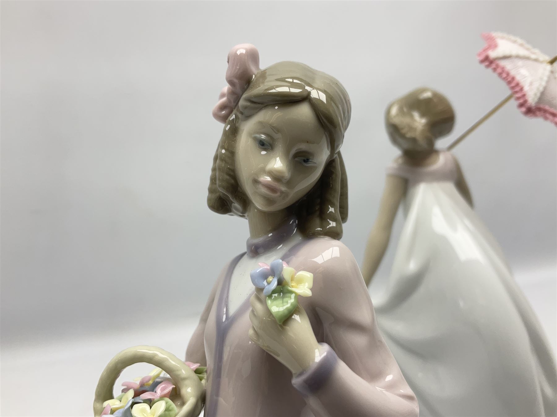 Two Lladro figures, comprising Innocence in Bloom no 7644 and Afternoon Promenade no 7636, both with original box, H28cm