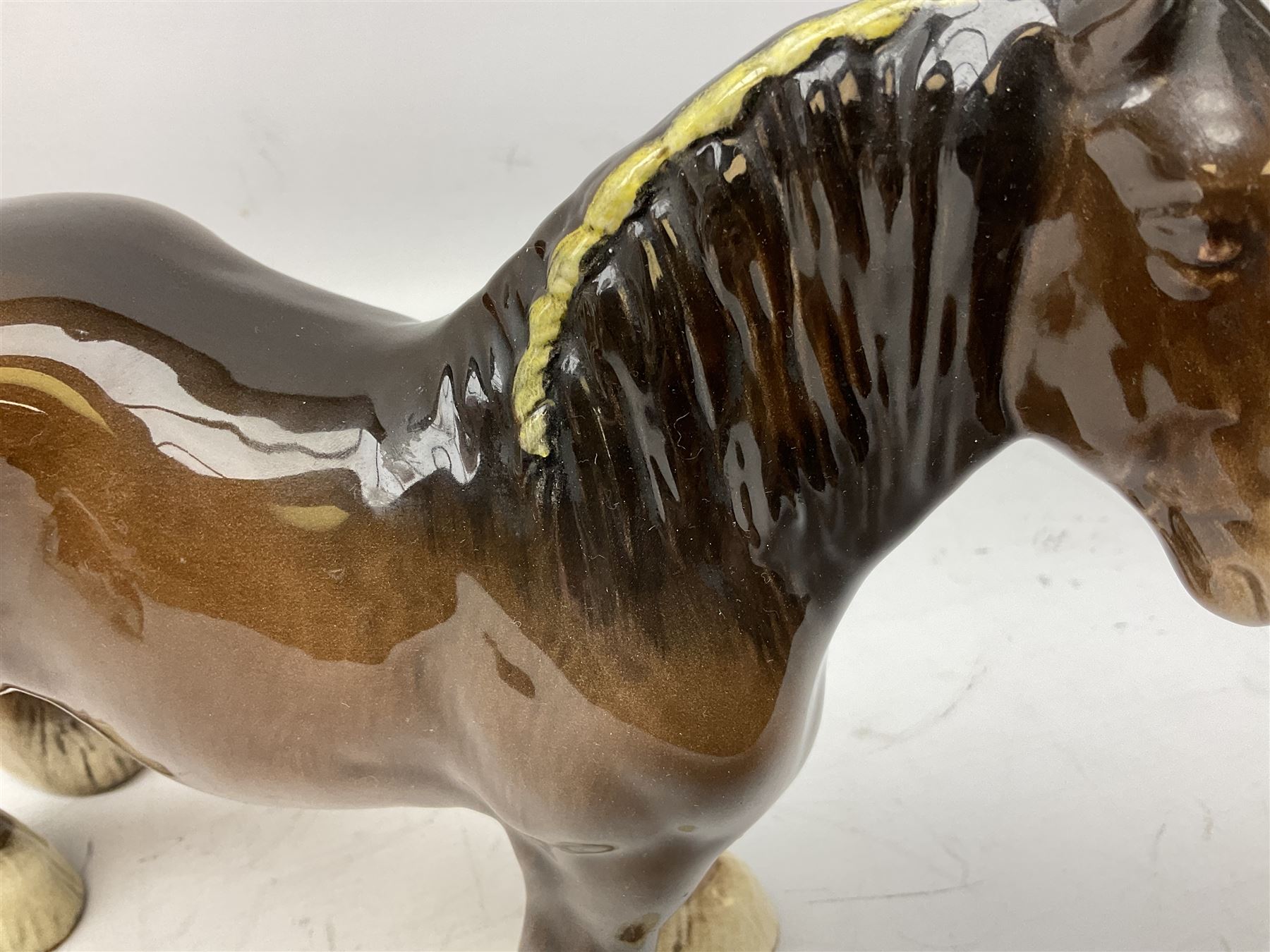 Three Beswick models comprising Hereford Bull no 949, 'CH Cutmil Cupie' Pug, and bay Shire horse, all with printed marks beneath