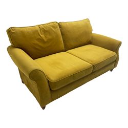 Next Furniture - traditional shaped three-seat sofa, upholstered in mustard velvet, rolled arms with pipping, on turned front feet
