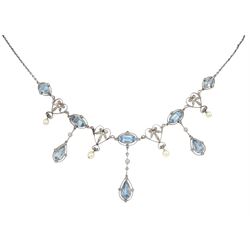 Early 20th century platinum milgrain set aquamarine, diamond and pearl trace link chain fringe necklace, circa 1910, five oval aquamarines, three with diamond and pear shaped aquamarine drops separated by four diamond heart shaped details, each with a suspended pearl