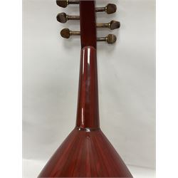 20th century Middle Eastern six string lute with a segmented back and a purpose designed hardwood stand