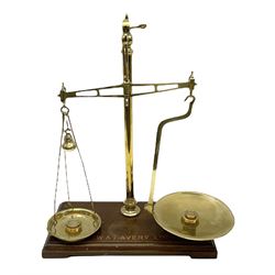 W & T Avery set of counter-top brass beam scales and weights, upon a stepped wooden plinth, H46cm