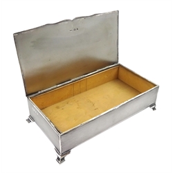 Silver cigarette case, engine turned decoration and cartouche to lid, on ogee bracket feet by Hasset & Harper Ltd, Birmingham 1930