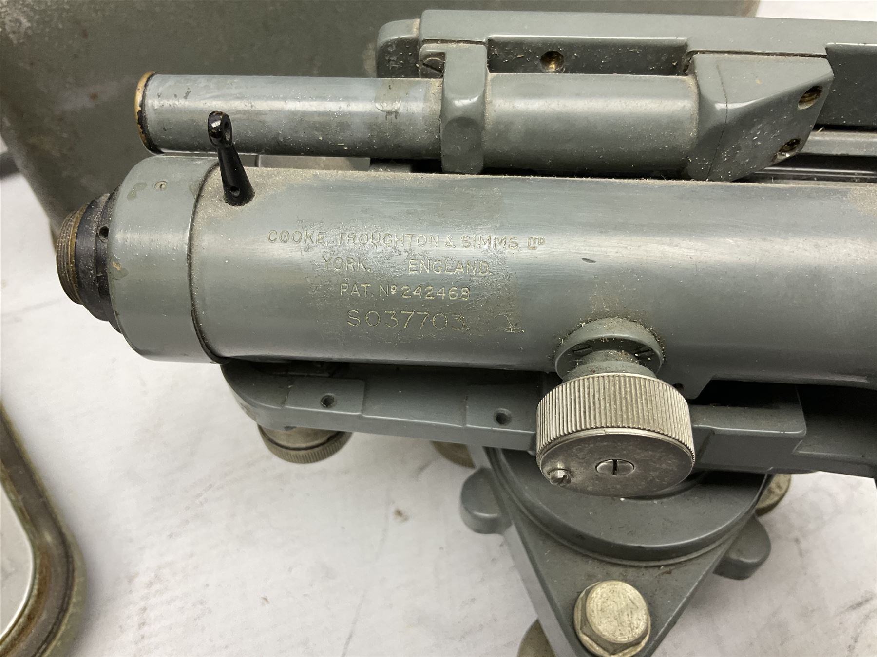 Swiss Kern K1-RA engineer's self-reducing tachymeter theodolite, serial no.197914, with metal cover; Hilger & Watts Ltd. theodolite, serial no.114671, with tool set and metal over; Cooke Troughton & Simms Ltd. tilting level, serial no.SO377O3; uncased; and mahogany hinged  measuring staff (4)