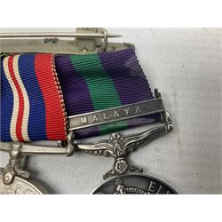 WWII group of five medals comprising 1939-1945 War Medal, Defence Medal, Africa Star, 1939-1945 Star and 1918-1962 General Service Medal with Malaya clasp awarded to Capt. J.E. Maskell R.A.O.C.; with ribbons on hanging bar; and matching group of miniatures, RAOC shoulder title, rank pips etc