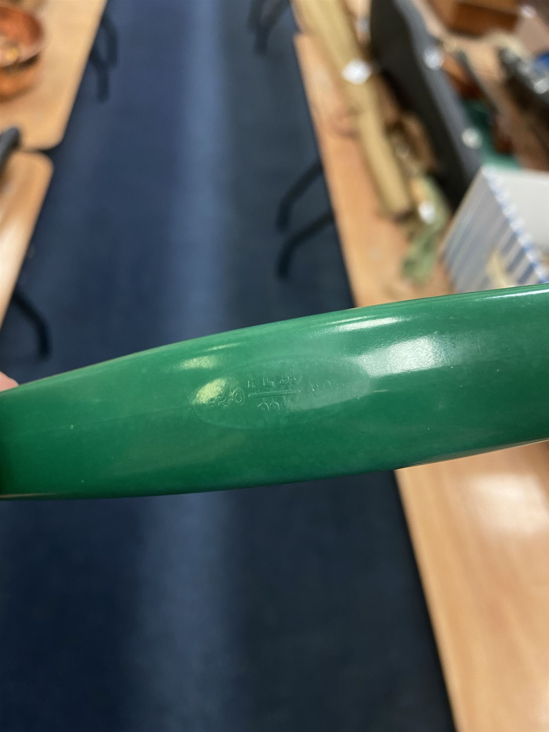 Jade green Bakelite telephone, of pyramid form with alphabet dial, brown braided handset cord and a base draw