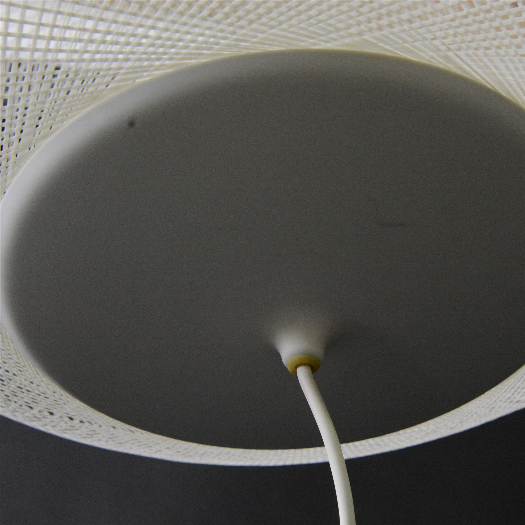 Moooi - NR2 pendant light, circular openwork shade formed from fine white threads in a complex woven lattice, enclosing an internal light source, suspended from a white cable and ceiling rose