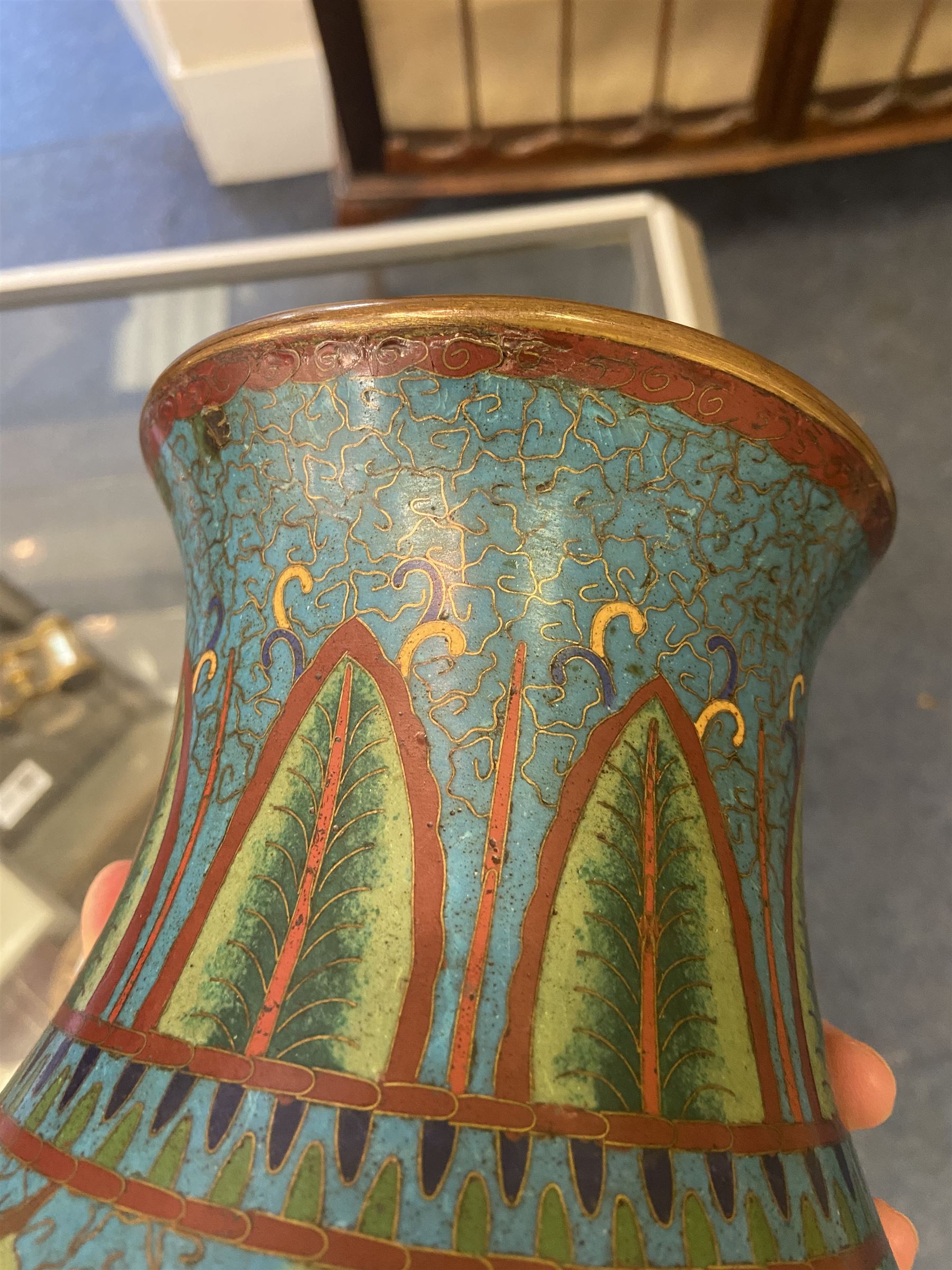 Japanese Cloisonne vase, Meiji/Taisho period, decorated with five haloed figures, possibly the Lucky Gods or Monks, in a landscape detailed with pine trees, lotus flowers and auspicious clouds, beneath a neck with band of fronds, with apocryphal Ming mark beneath, H31cm