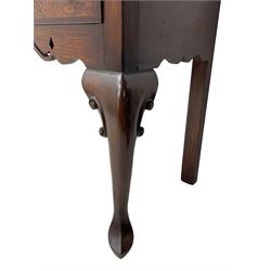 Georgian design oak and mahogany dresser base, the rectangular moulded top with mahogany band, three cocked-beaded and banded drawers over shaped a pierced apron, circular brass handle plates and swan neck handles, on C-scroll carved cabriole supports 