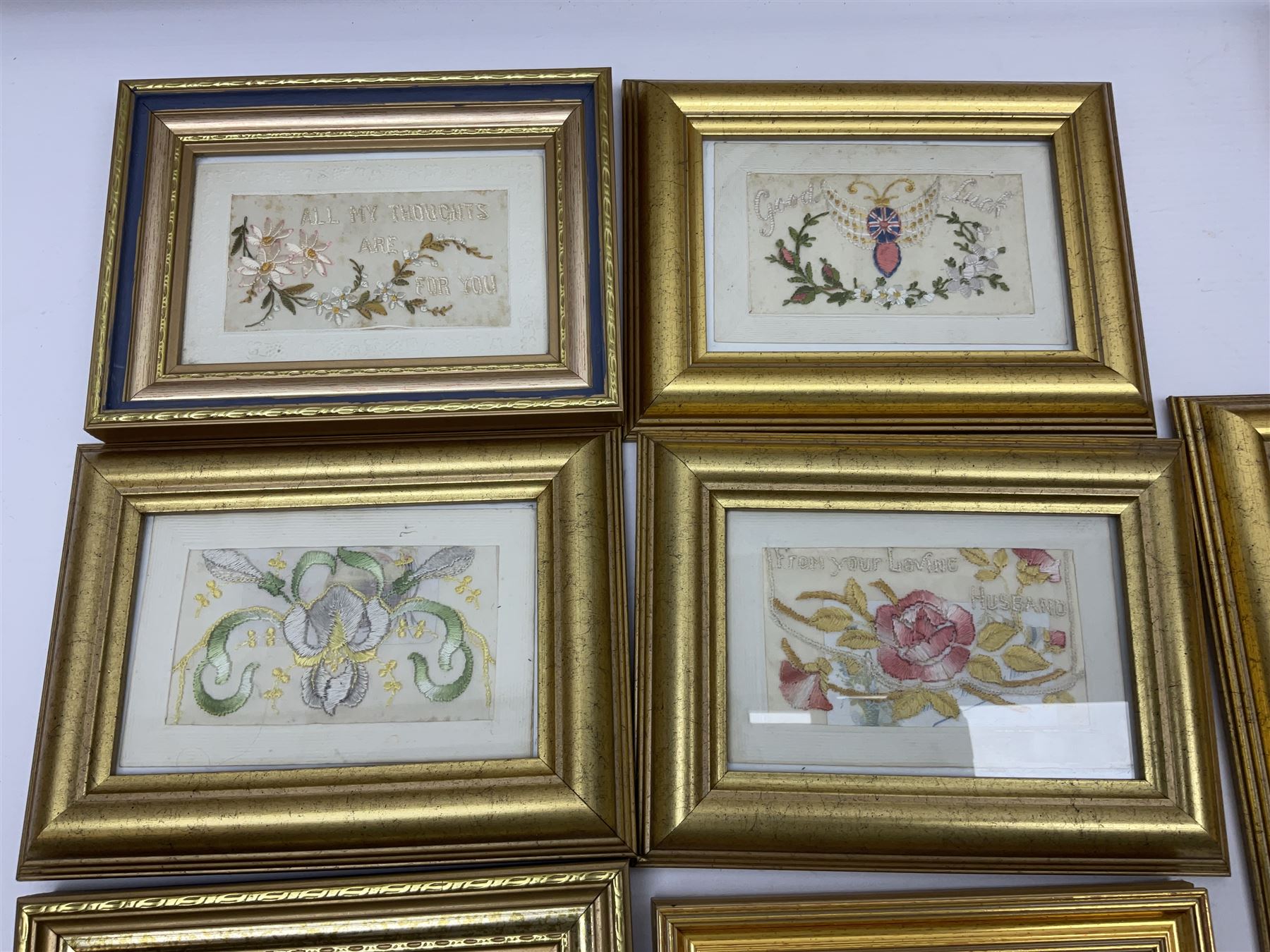 Collection of twenty eight, mostly WWI period embroidered silk greetings cards and postcards, including 'A kiss from France', good luck, sweetheart and Christmas examples, all within modern gilt frames