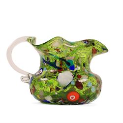 Two Murano Glass jugs by Zecchin, the fist decorated with millefiori design, upon a purple mottled ground, the other upon a green ground, H10cm