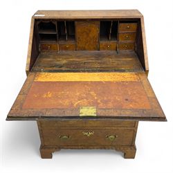 George III figured walnut bureau, fall-front enclosing central cupboard, six pigeonholes and six drawers, fitted with four graduated cockbeaded drawers, on bracket feet
