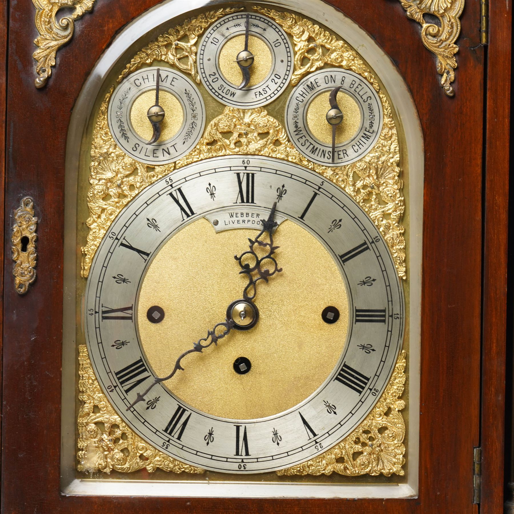 Late 19th century bracket clock with three train movement, Westminster Chimes on eight bells and gong strike, the brass dial inscribed 'Webber Liverpool' with gilt brass mounts in mahogany dome top case with pineapple finial, brass handles and classical columns on compressed circular feet H76cm